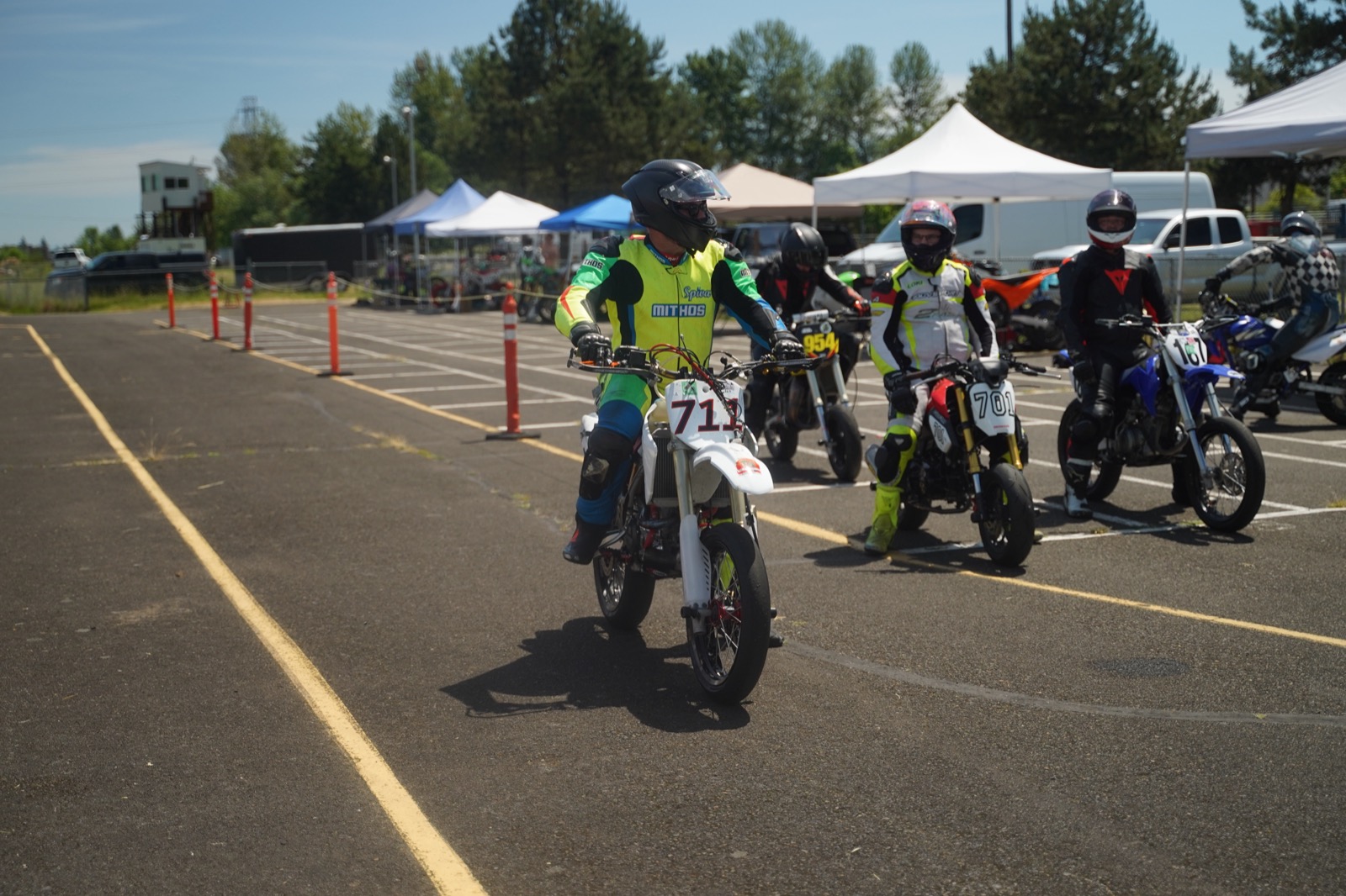 Jonathan Spiva (#711) staged on the grid with other riders before a race