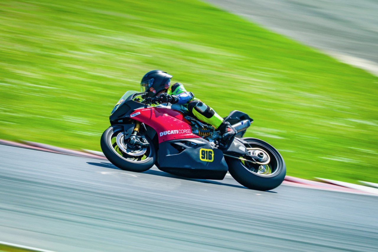 Jonathan Spiva (#916) leaned over at Portland International Raceway