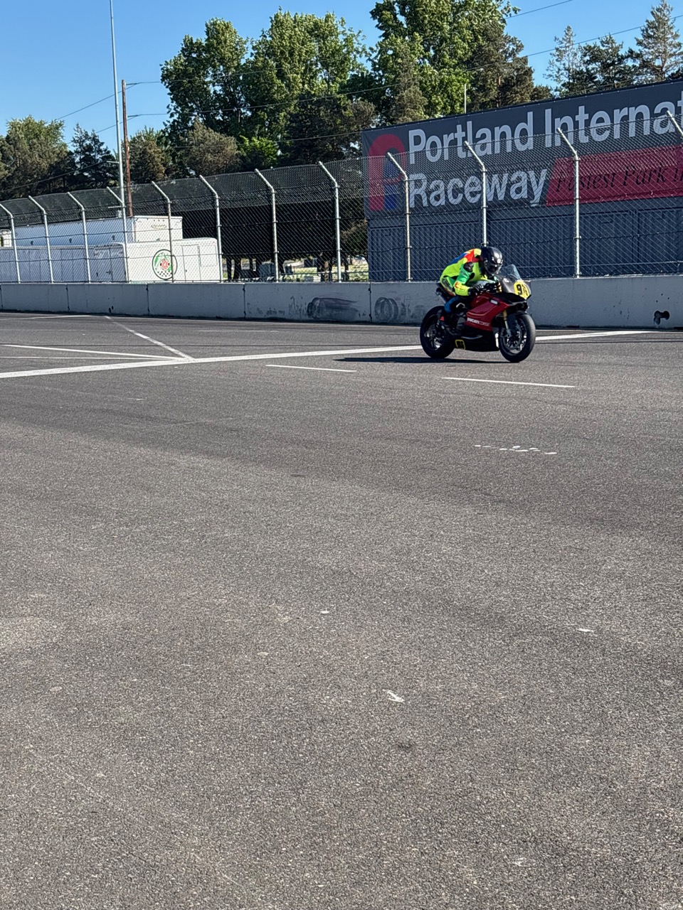 Jonathan Spiva on the #916 Ducati in front of the Portland International Raceway sign