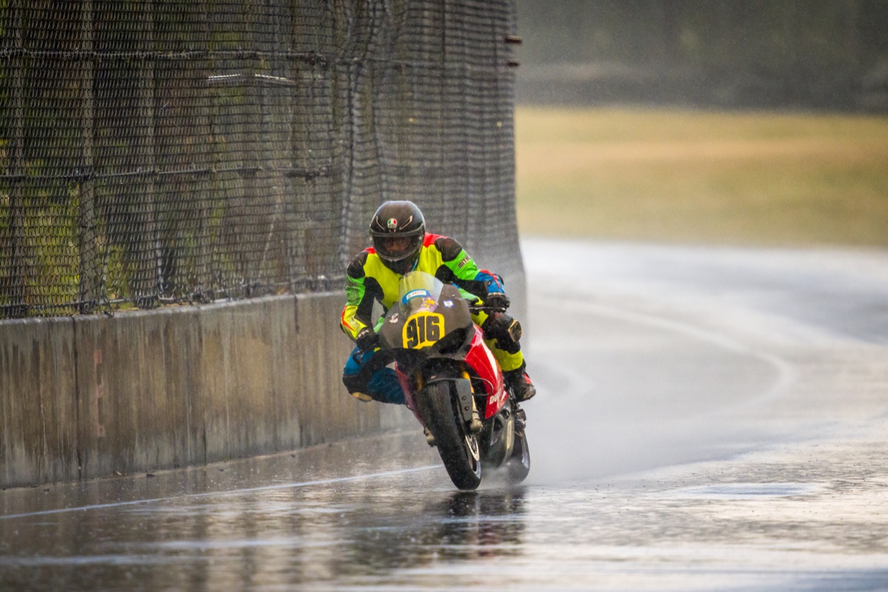 Jonathan Spiva (#916) racing in the rain at PIR
