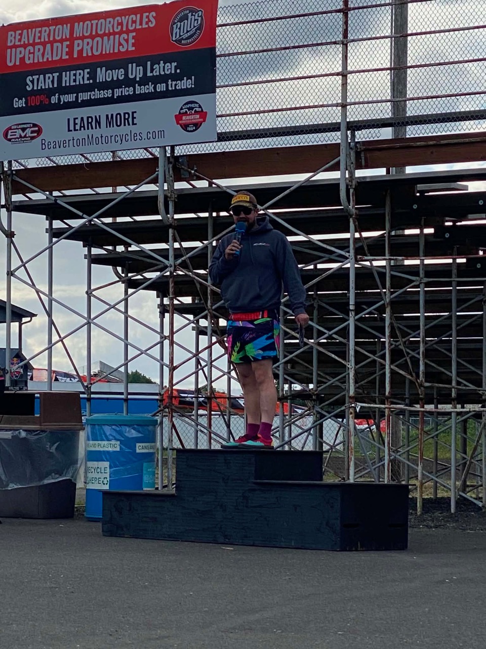 Jonathan Spiva on the podium box with a microphone at PIR