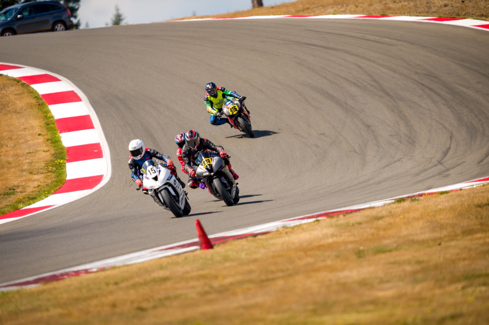 Jonathan Spiva (#916) running behind Jacob Marshall (#15), Steve Schock (#930) and Eric Lin (#997) into Turn 8a on the first lap at The Ridge Motorsports Park