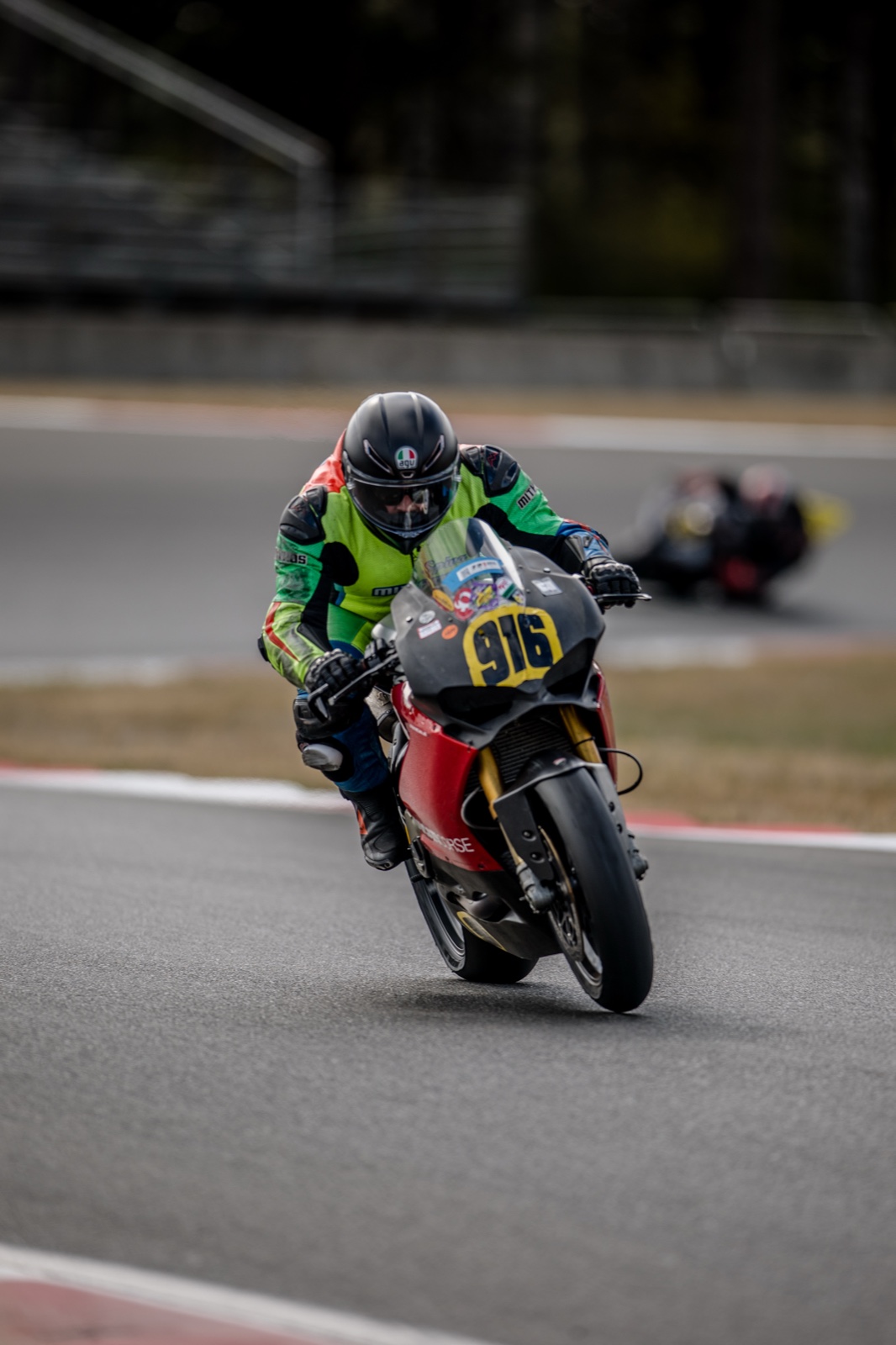 Jonathan Spiva (#916) lifting the front wheel of the Ducati Panigale R through Turn 16 at The Ridge Motorsports Park