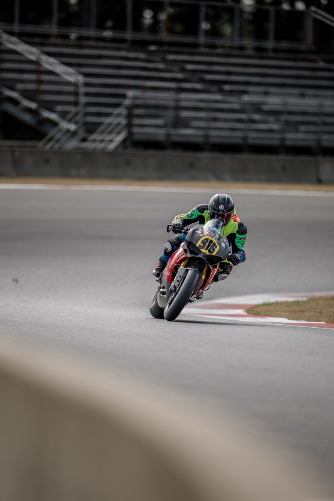 Jonathan Spiva (#916) driving the Ducati Panigale R out of Turn 15 with the front wheel light at The Ridge Motorsports Park