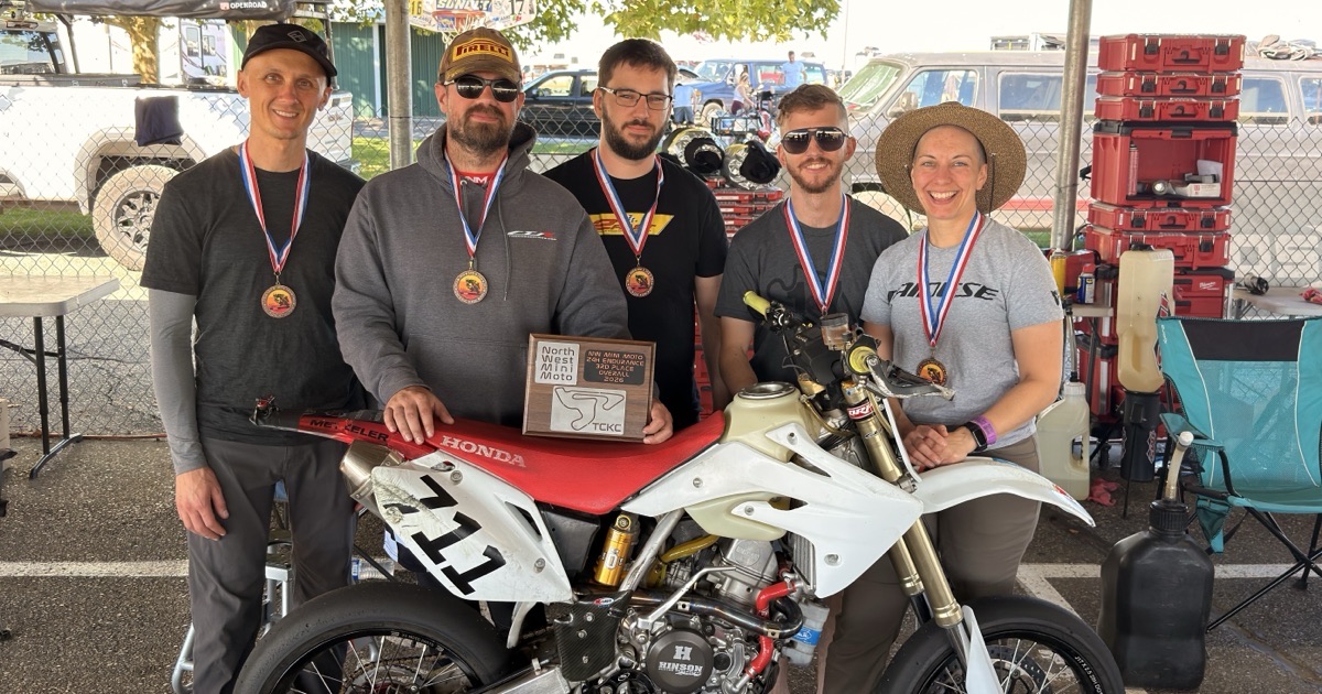 The Spiva Racing Team with their medals, the third place plaque and the Honda CRF150R #711 at TCKC