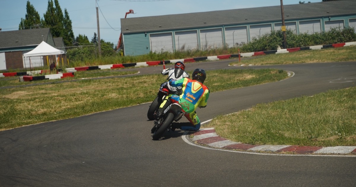 Jonathan Spiva (#711) cornering the Honda CRF150R foot-out at Mac Track