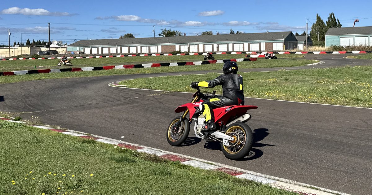 Jonathan Spiva (#711) riding the Ducati Desmo450 through a corner at Mac Track