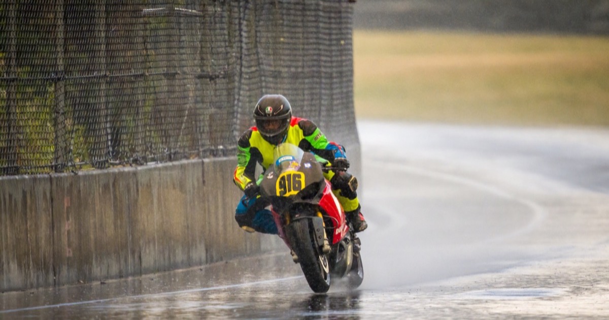 Jonathan Spiva (#916) racing in the rain at PIR during Round 3